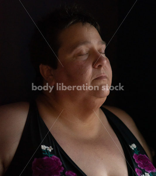 Plus Size Stock Photo: Woman in Dark Room - Body Liberation Photos