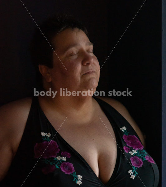 Plus Size Stock Photo: Woman in Dark Room - Body Liberation Photos