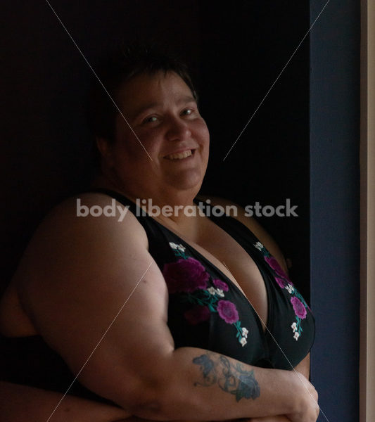 Plus Size Stock Photo: Woman in Dark Room - Body Liberation Photos