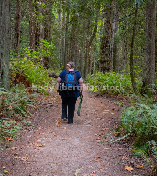 Plus Size Woman Hikes on a Trail in the Woods Carrying a Stool - It's time you were seen ⟡ Body Liberation Photos