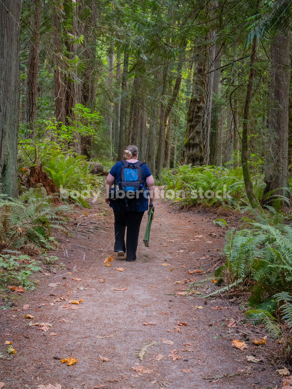 Plus Size Woman Hikes on a Trail in the Woods Carrying a Stool - It's time you were seen ⟡ Body Liberation Photos