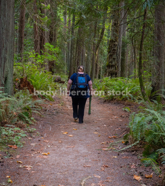 Plus Size Woman Hikes on a Trail in the Woods Carrying a Stool (further) - It's time you were seen ⟡ Body Liberation Photos