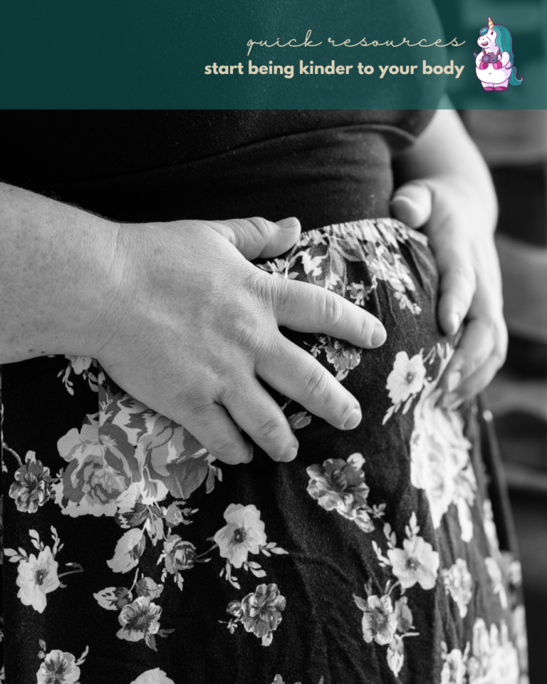 A fat woman practices body kindness with her hands on her belly over a floral skirt.